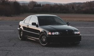 black mercedes benz coupe on road during daytime