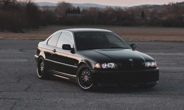 black mercedes benz coupe on road during daytime